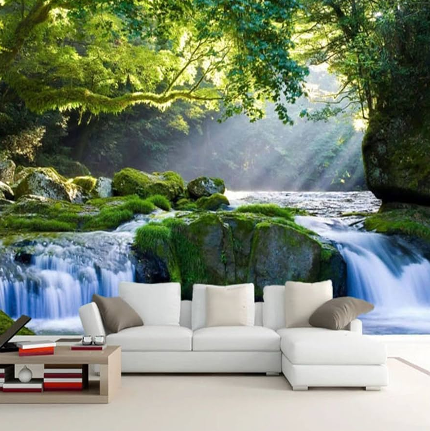 Large wall mural of a lush forest waterfall with moss covered rocks and sunlight streaming through trees behind a white sectional sofa.