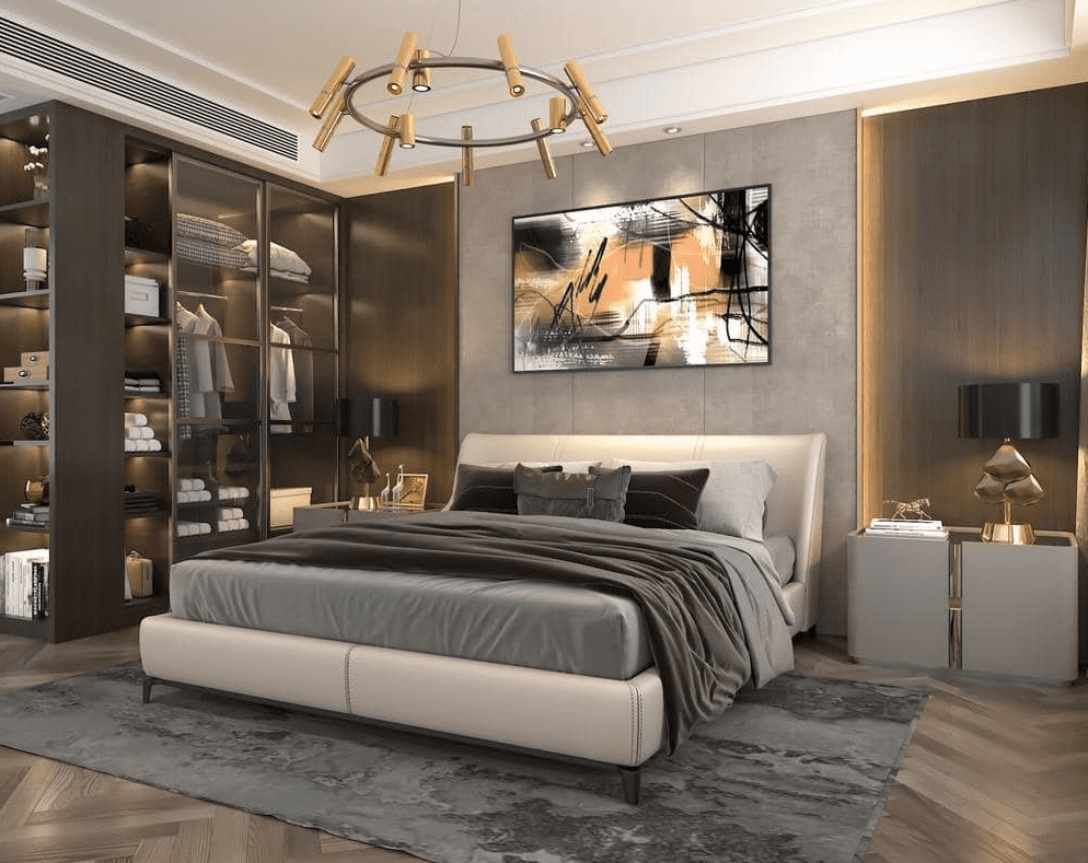 Luxurious master bedroom with upholstered bed, warm wood paneling, open wardrobe with soft lighting, abstract artwork, and gold modern chandelier creating a serene retreat.