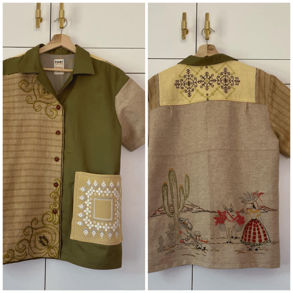 Front and back views of an upcycled short sleeve shirt made from mixed textiles in olive green and tan, featuring embroidered panels, a large patterned pocket, and a back scene with cactus and figures.
